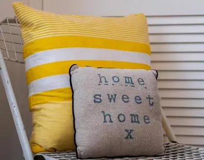 a pillow with the words home sweet home written on it at The View in Port Isaac
