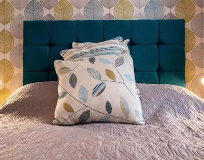 a pillow sitting on top of a bed at The View in Port Isaac