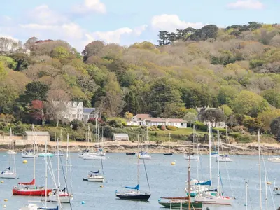 a bunch of boats are docked in a harbor at 16 Arwenack Street in Falmouth