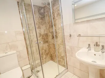 a bathroom with a shower and a sink at 16 Arwenack Street in Falmouth