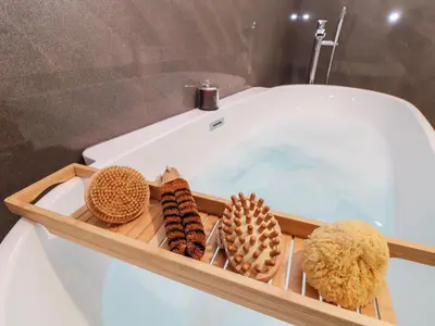 a tray with several different types of shells in a bath tub at Penthouse 23 in Newquay