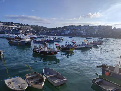 a group of boats sitting in the water at Cheerful Fisherman,s Cottage in St Ives