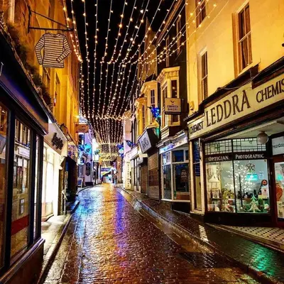 an empty street in a city with lights at Cheerful Fisherman,s Cottage in St Ives