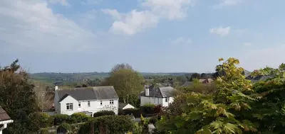 a view of a village with houses and trees at Hillside in St Austell