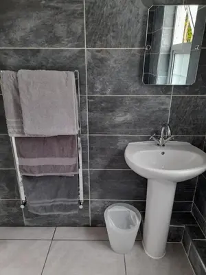 a bathroom with a sink and a mirror at Bosloe in Helston