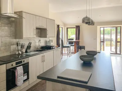 a kitchen with a large counter top in a room at The Hurlers in Saint Cleer
