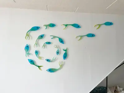 a group of peacock feathers on a wall at Island View - 3 Bedroom Holiday Cottage - 40m to Porthgwidden Beach - Sleeps 7 - inc FREE Parking in St Ives