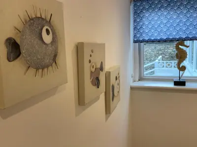 a room with two light switches and a window at Island View - 3 Bedroom Holiday Cottage - 40m to Porthgwidden Beach - Sleeps 7 - inc FREE Parking in St Ives