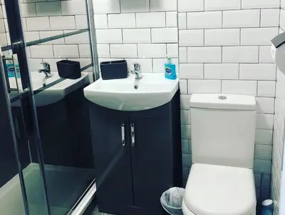 a bathroom with a toilet and a sink at Newquay Holiday Home in Newquay