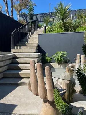 a statue of a cactus with stairs in the background at Chy conary in Carbis Bay