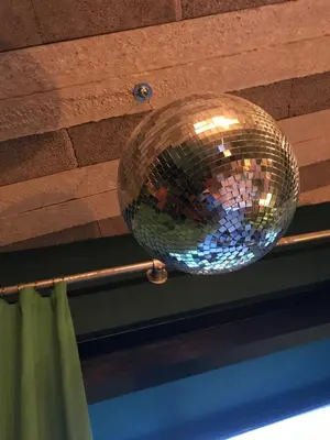 a disco ball is hanging from a ceiling at Chy conary in Carbis Bay