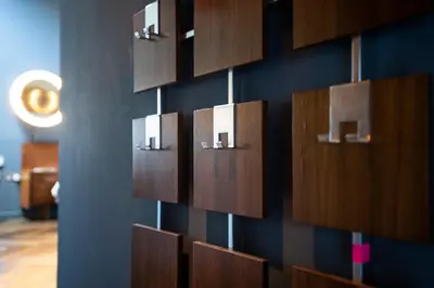 a wall with many wooden boxes on a wall at Chy conary in Carbis Bay