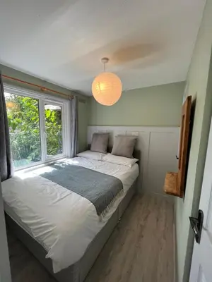 a bedroom with a large bed and a window at 81 Hengar Manor in Bodmin