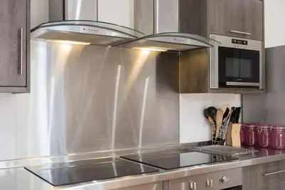 a kitchen with a stainless steel stove top oven at Sea View, Newquay Spacious house in Newquay