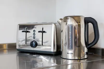 a toaster sitting on top of a kitchen counter at Sea View, Newquay Spacious house in Newquay