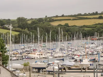 a bunch of boats are docked in a marina at Flat 6 in Falmouth