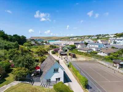 an aerial view of a house with a parking lot at Baywatch Sands in Wadebridge