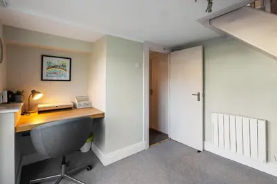 a home office with a desk and a chair at Beautiful 3 bedroom cottage in the heart of Looe in Looe