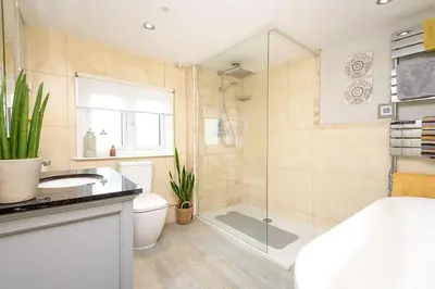 a bathroom with a shower and a toilet and a sink at Beautiful 3 bedroom cottage in the heart of Looe in Looe