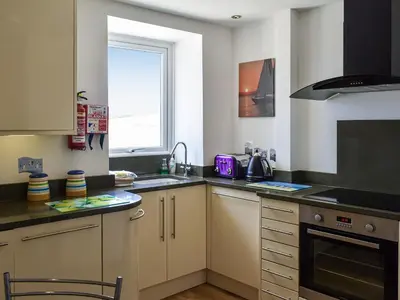 a kitchen with a sink and a stove top oven at Pennti Treth - Uk39455 in Saint Columb Minor