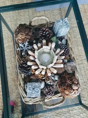 a glass display with pine cones and a centerpiece at Looe with a View - Entire apartment with FREE allocated parking in Looe