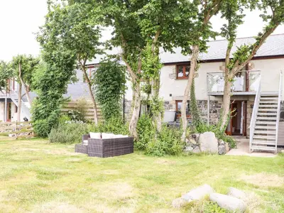a house with a garden in front of it at Polurrian House in Helston