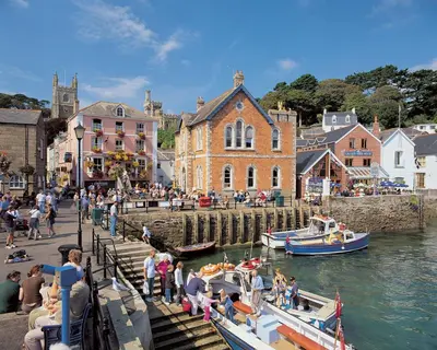 a group of boats docked at a dock in a harbor at Detached House 2 Bed Sleeps 4 Parking in Fowey