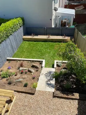a backyard with a garden with flowers and plants at Stylish 3 bed home with allocated parking for 2 in Liskeard