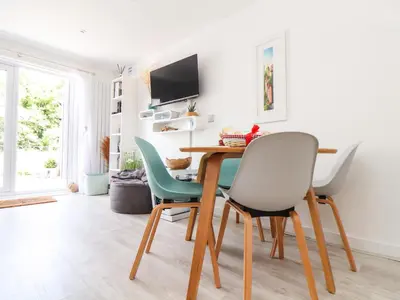 a dining room with a table and chairs at Penpoll in Wadebridge