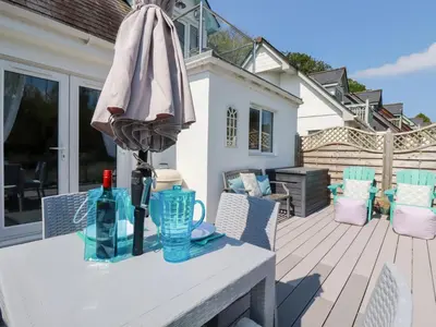 an umbrella sitting on a table on a patio at Penpoll in Wadebridge
