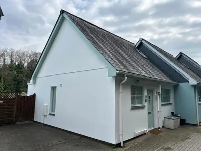 a white house with a gambrel roof at Penpoll in Wadebridge