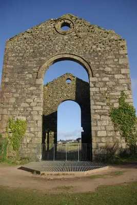 an arch in a stone building with a gate at Rural retreat, central location, close to beaches in Camborne