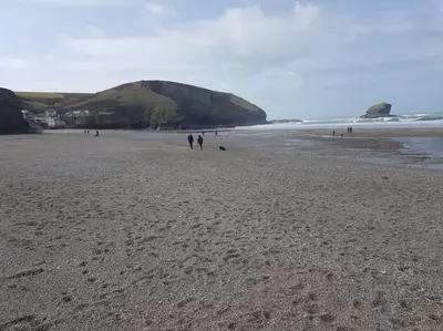 a group of people walking on a beach at Rural retreat, central location, close to beaches in Camborne
