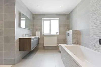 a bathroom with a tub and a sink at Shackled-Am-Not - Luxury home sleeps 8 with hot tub and games room North Cornwall in Camelford
