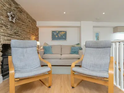 two chairs and a couch in a living room at Dayan Cottage in Fowey