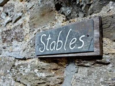 a sign on the side of a stone wall at Stables - Uk31176 in Saint Martin