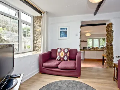 a living room with a purple couch and a tv at Stables - Uk31176 in Saint Martin
