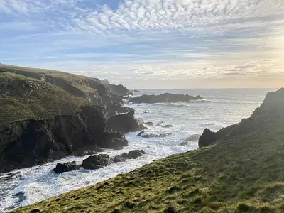 a view of the ocean from a cliff at Honeysuckle Cottage in Cury