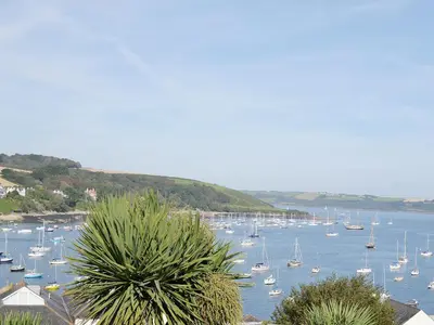 a bunch of boats are docked in a harbor at Honeysuckle Cottage in Cury