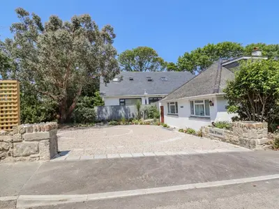 an empty driveway in front of a house at The Pines in St Ives