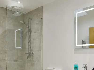a shower with a glass door in a bathroom at Little Trevose in Padstow
