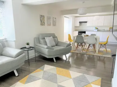 a living room with a couch and chairs and a table at Your luxurious and secluded retreat in Cornwall in Helston