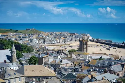 an aerial view of a town with a beach at Len's Lookout in St Ives