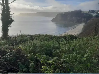 a view of the ocean from a hill with a beach at The Captain's House Charlestown St Austell in Charlestown