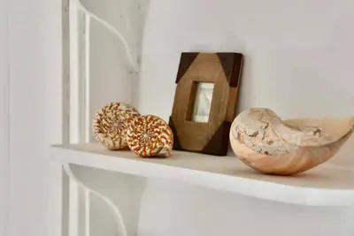 a shelf with some objects on top of it at Sunny Corner in Port Isaac