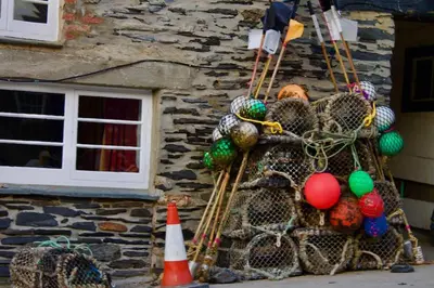 a net with balls in it next to a building at Sunny Corner in Port Isaac