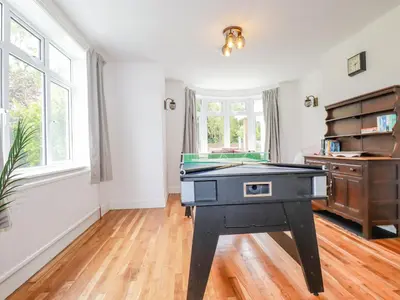 a room with a ping pong table in it at Pen-Y-Thon House in Newquay