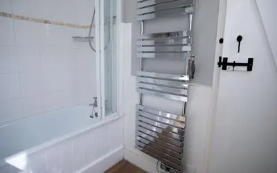 a bathroom with a shower and a window at Brakestone Cottage in the heart of Port Isaac in Port Isaac