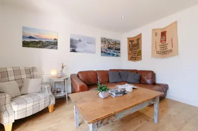 a living room with a couch and a coffee table at Finest Retreats - Seadog in Porthleven