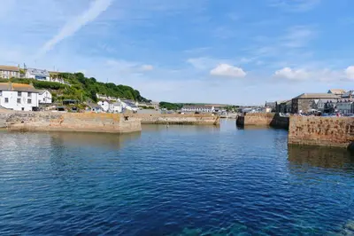 a view of a body of water with buildings and houses at Finest Retreats - Seadog in Porthleven